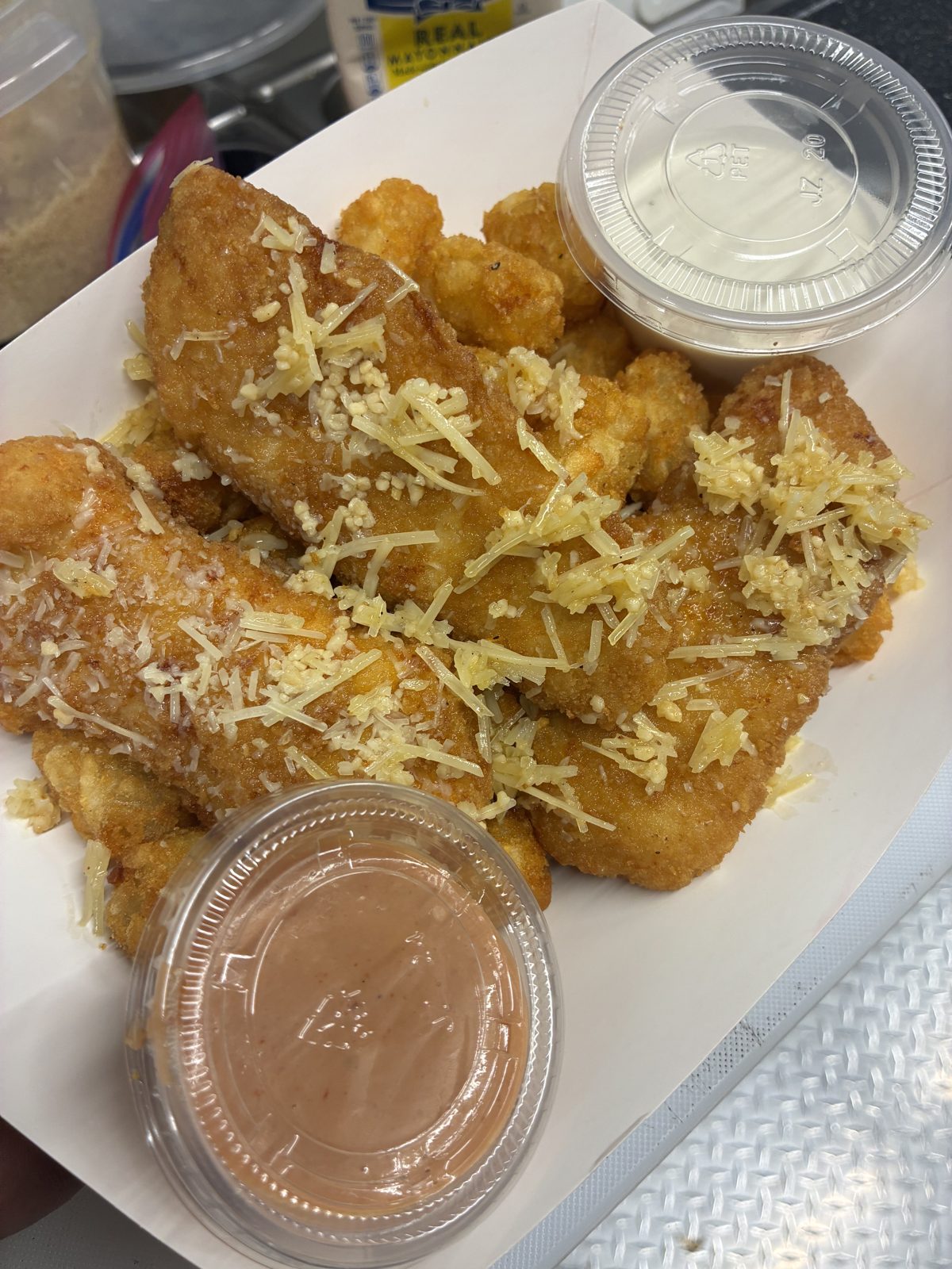 Chicken strips and tots with parmesan