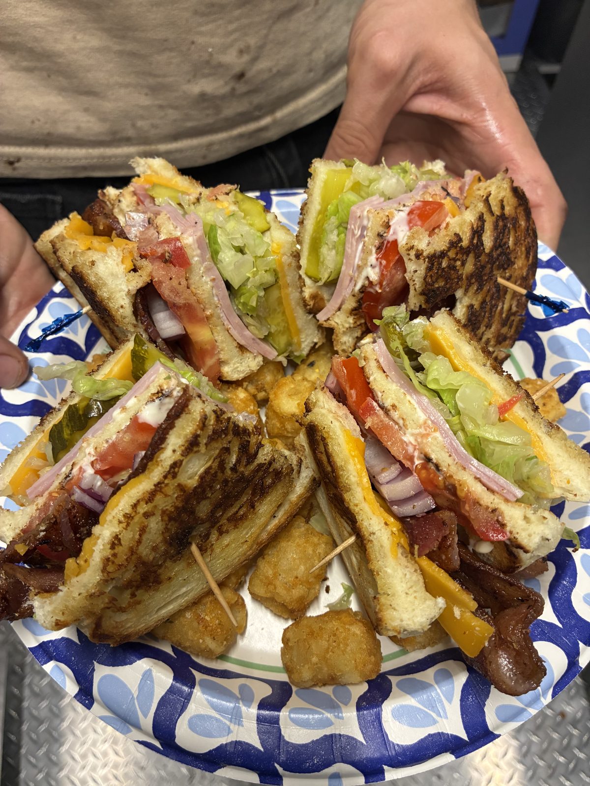 Stacked club sandwich with tots
