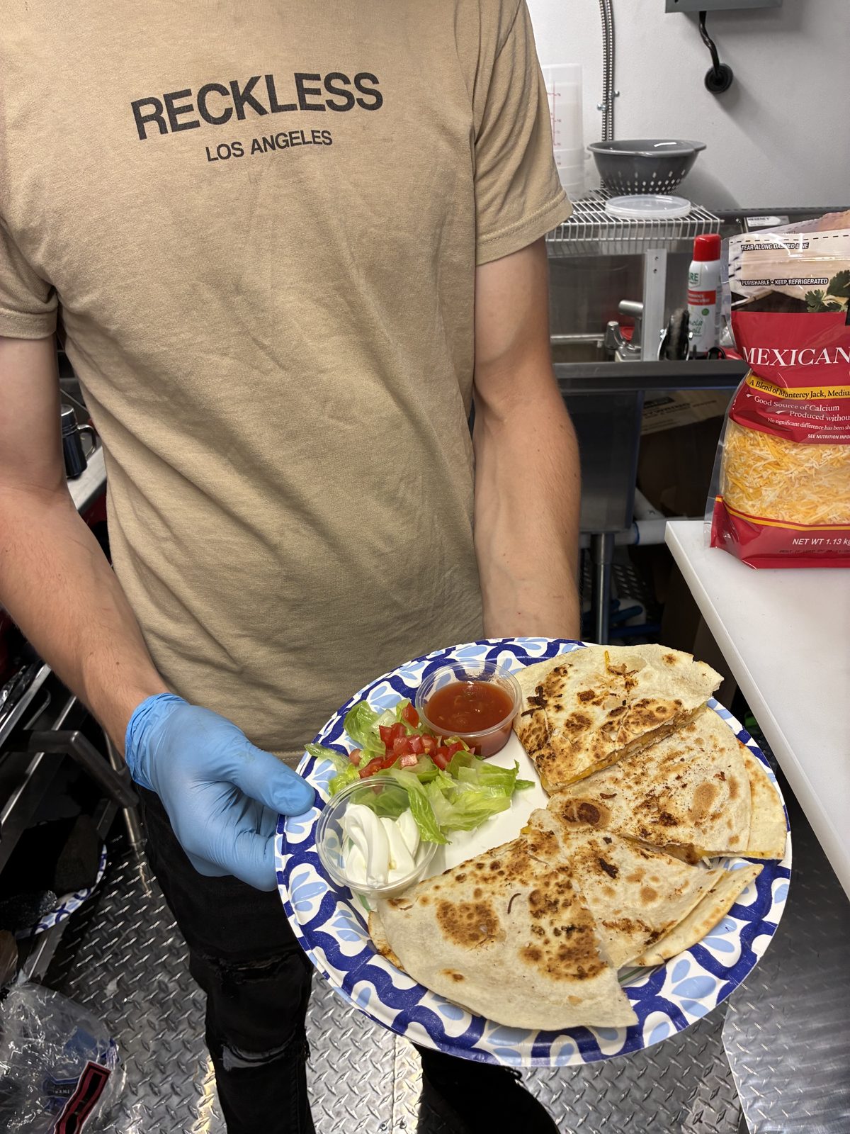 Chicken quesadilla with salsa and sour cream