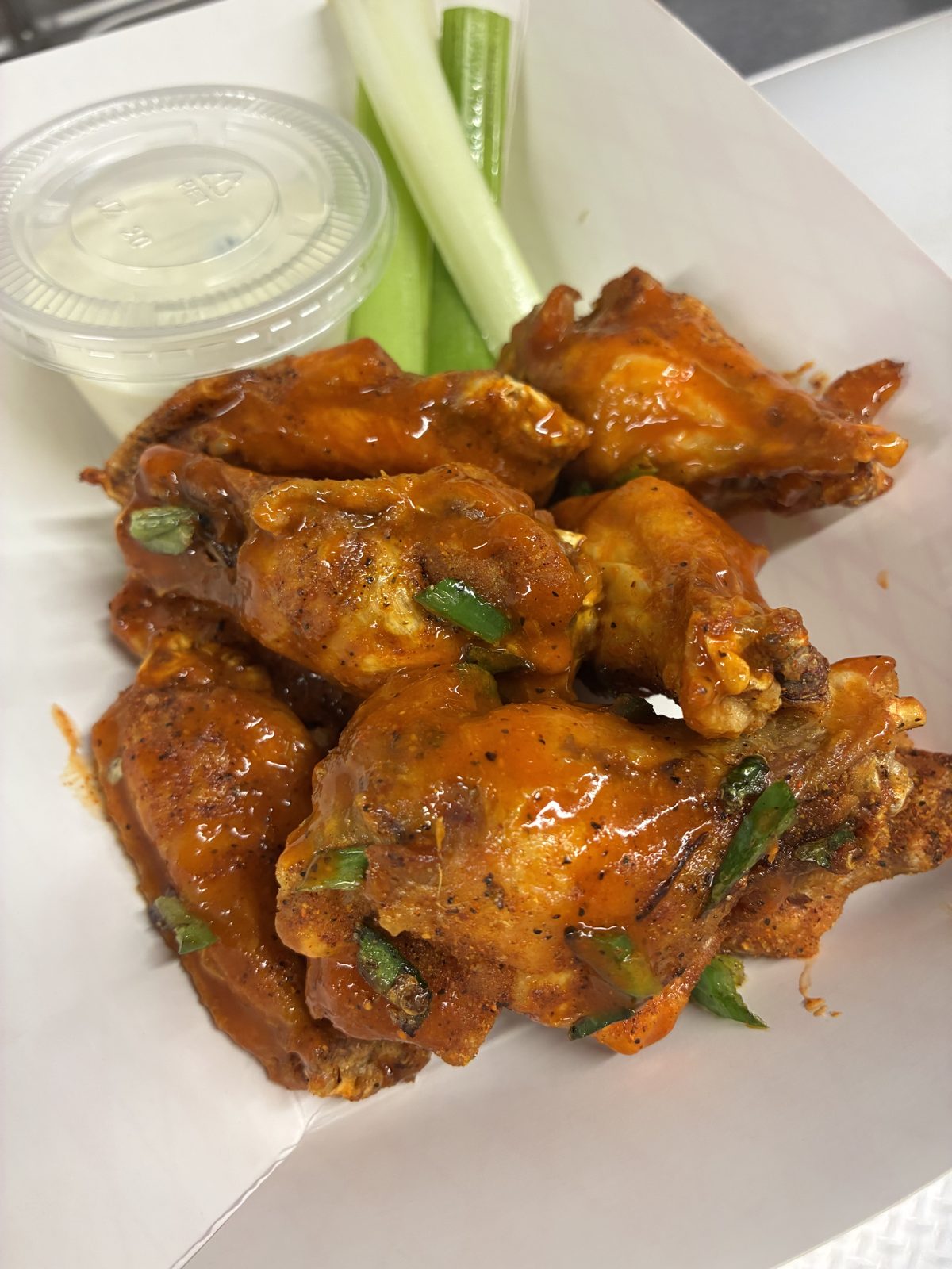 Buffalo wings with celery and blue cheese